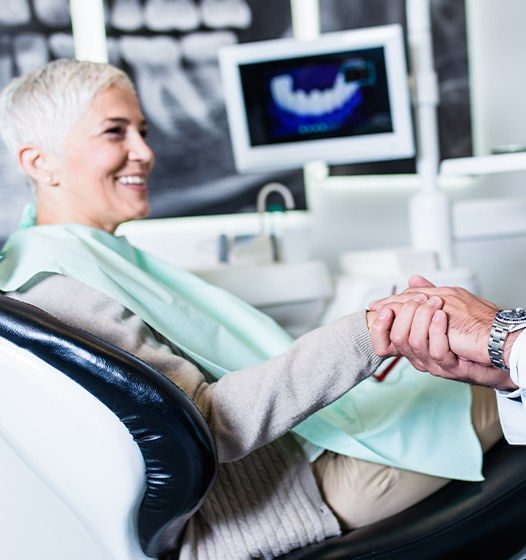 Woman discussing dental implant salvage with her periodontist